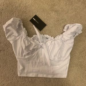 White crop top with bow in front off the shoulder